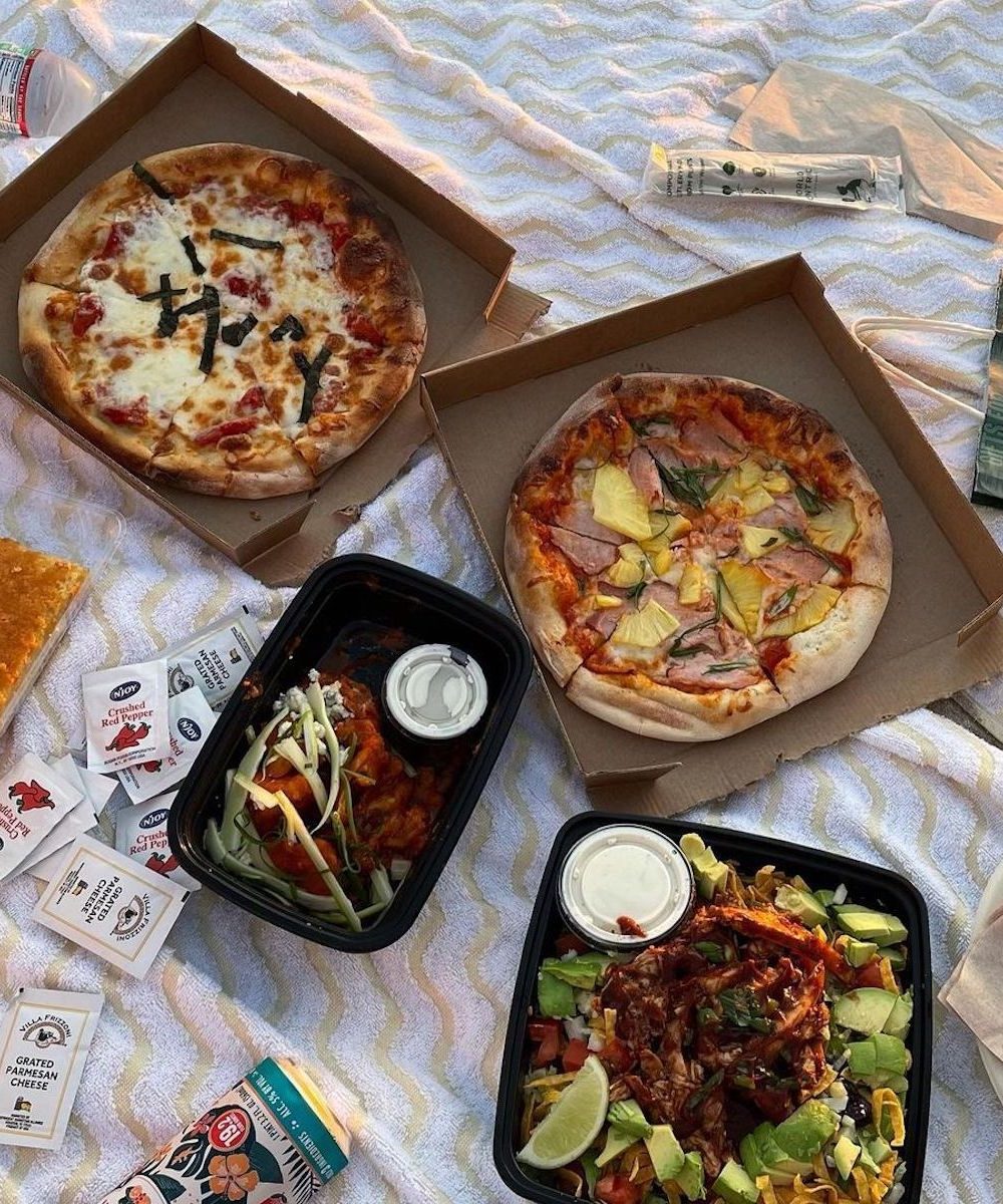 A picnic lunch of pizza and salad from CPK