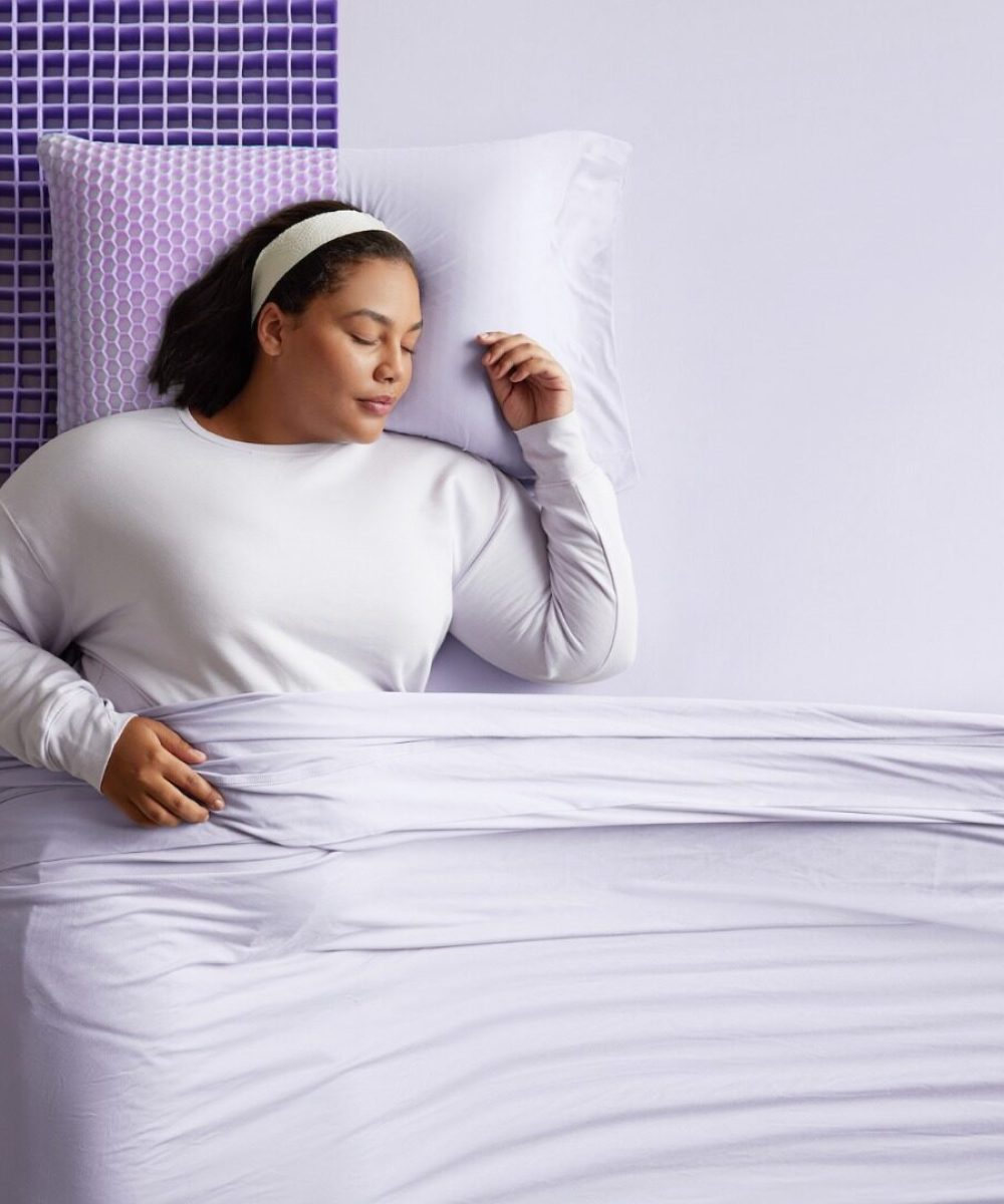 Woman sleeping on a Purple mattress
