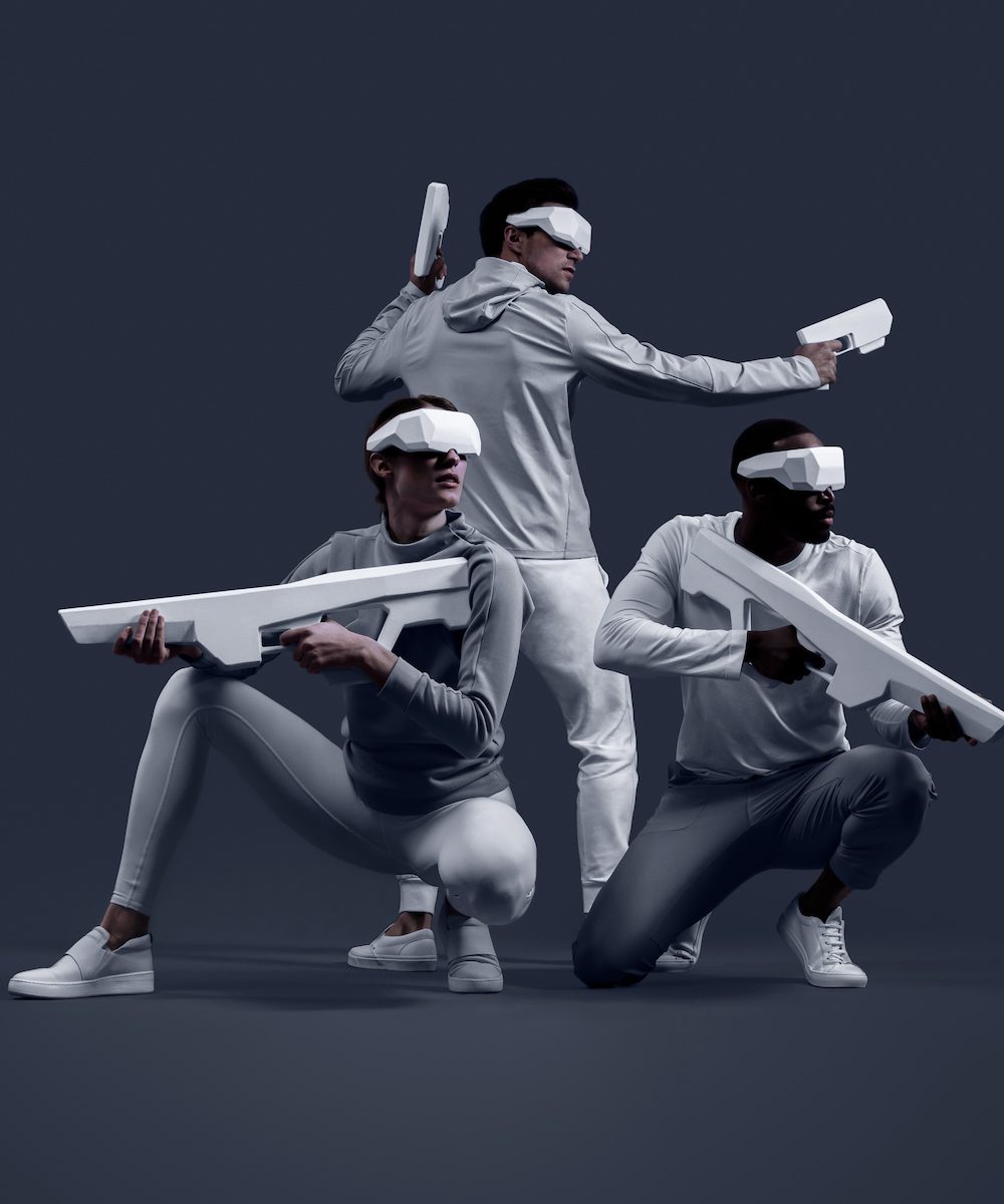 Three people experience a virtual reality game at SandBox VR
