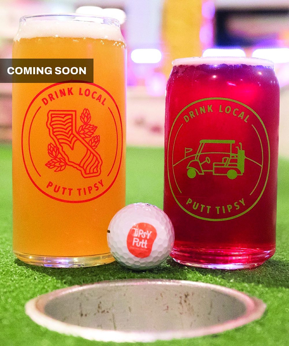 Two pints of beer in front of a golf ball at Tipsy Putt
